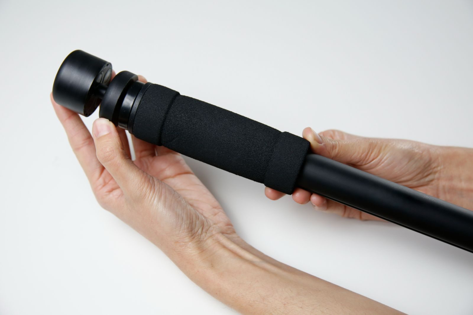 Portable Mini on a pole held in two hands